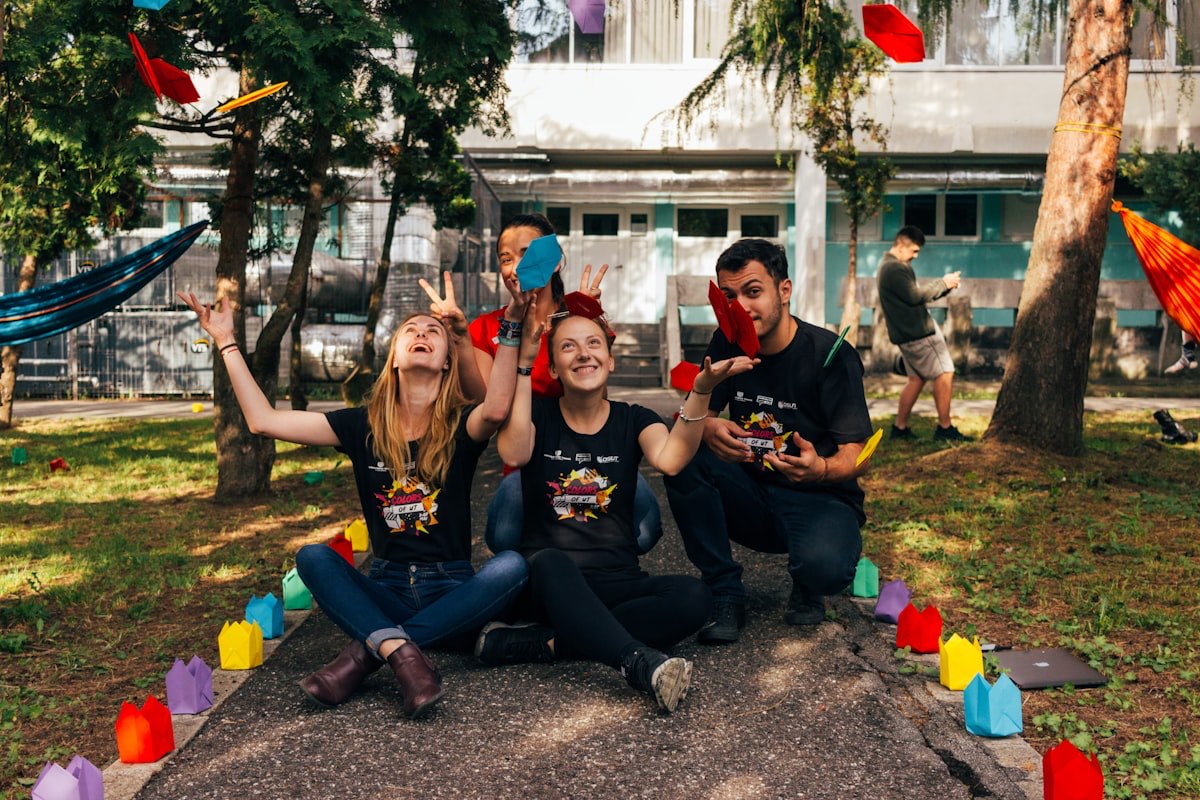 Young volunteers celebrating together outdoors